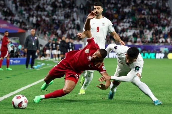 Momen Timnas Iran menghadapi tuan rumah Qatar di Piala Asia 2023. Foto REUTERSMolly Darlington